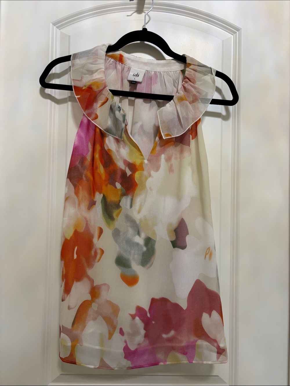CAbi Meadow Top. Floral Ruffle-Neck Sleeveless Blouse in Cream, Orange, Pink